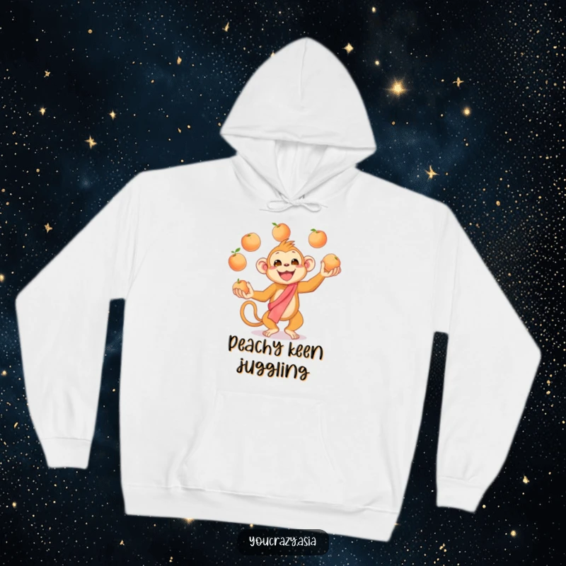 Funny Juggling Monkey Hoodie: A cheerful golden monkey in a silk sash enthusiastically juggles peaches, offering cozy warmth and humorous charm.