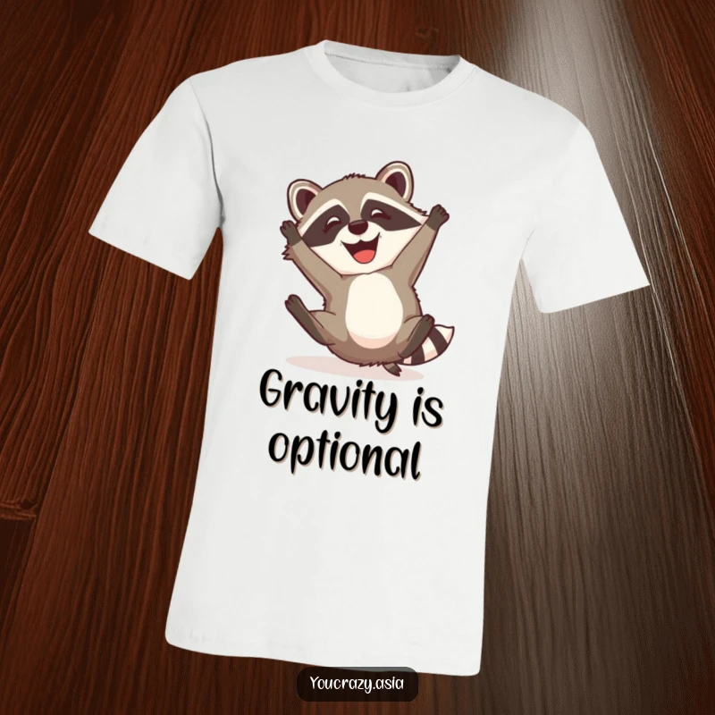 Funny Raccoon Dog T-Shirt: A mischievous raccoon dog with a happy grin attempts a somersault, showcasing a playful and humorous spirit.